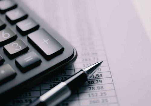 calculator-stationery-items-table-accounting-concept-scaled.jpg