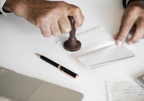 People checking bankbook isolated on white table